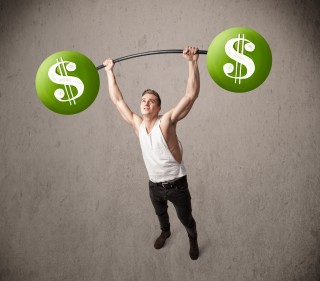 muscular man lifting green dollar sign weights