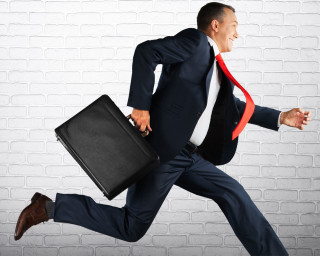 man-running-with-briefcase